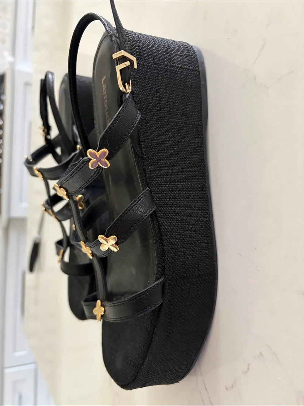 Larroude Black Harmony Sandals with Gold Flower Accents